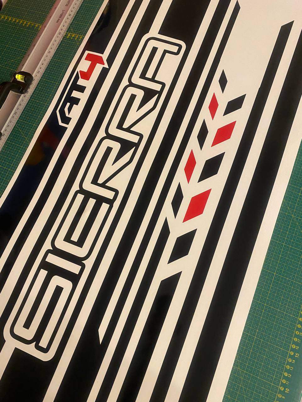 Premium GMC Sierra vinyl stripe decal with black, white and red racing graphics.