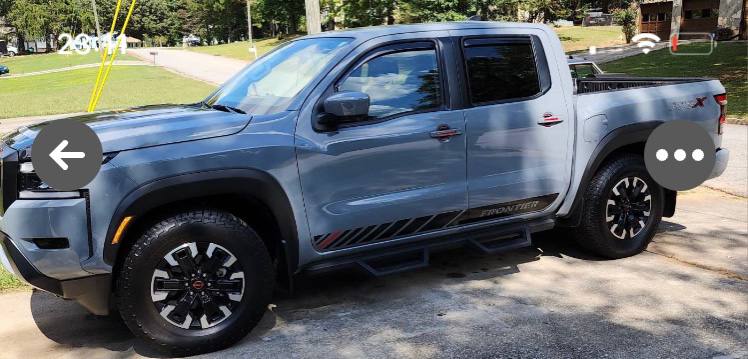 Nissan Frontier pickup with vinyl decal graphics installed on side