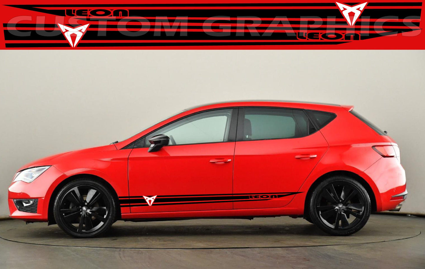 A red Seat Leon hatchback with a black stripe decal on the side.