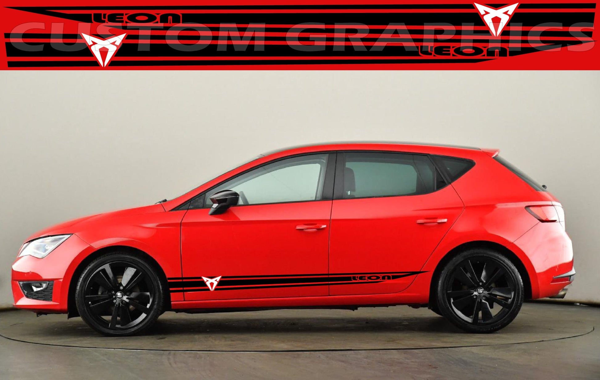 A red Seat Leon hatchback with a black stripe decal on the side.