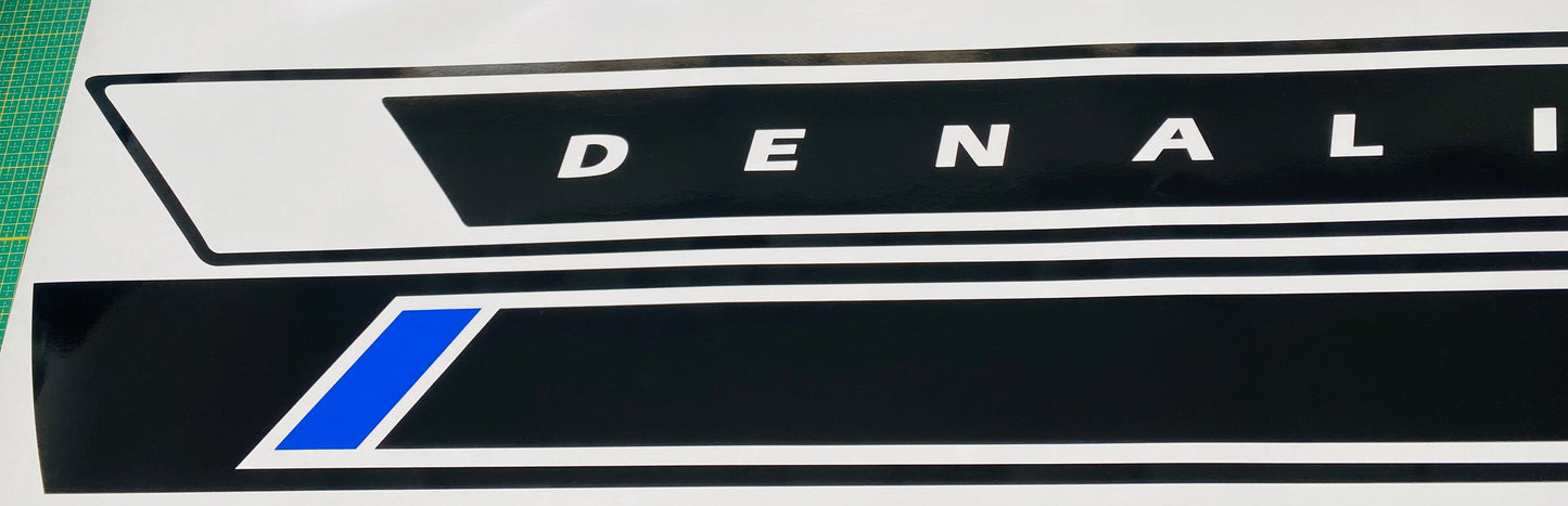 A white GMC Sierra truck with a premium vinyl sticker decal from Brothers-Graphics on the side.