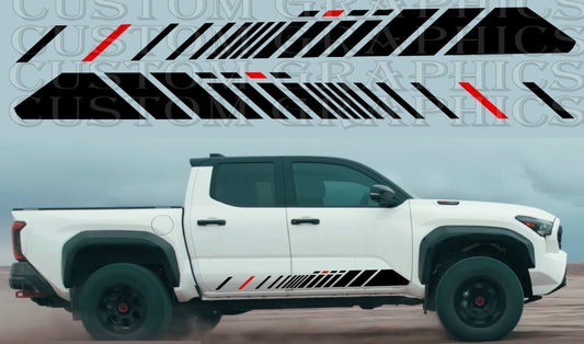 A white Toyota Tacoma pickup truck with a custom decal design featuring black and red stripes on the side.
