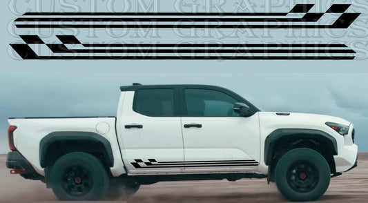 A white Toyota Tacoma pickup truck with a custom decal design on the side, featuring black and gray stripes and the branding 'Brothers Graphics'.