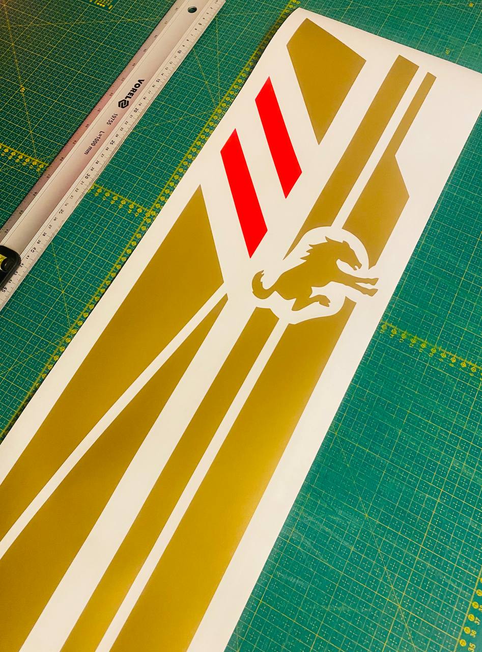 Gold vinyl racing stripe decal set with red accents and horse silhouette, ready for installation
