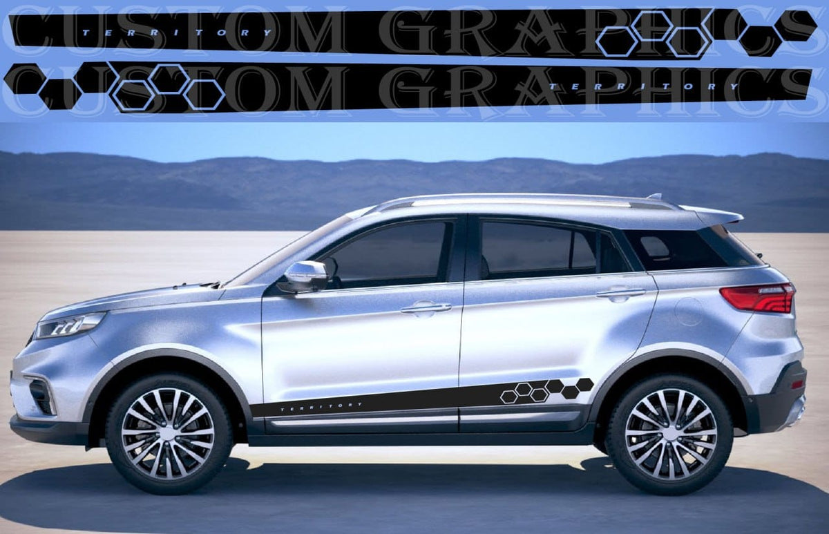 A silver SUV shown in side profile on a desert-like flat landscape with mountains in the background. The vehicle has black side graphics with a repeating hexagon pattern and small circular motifs along the lower side trim.