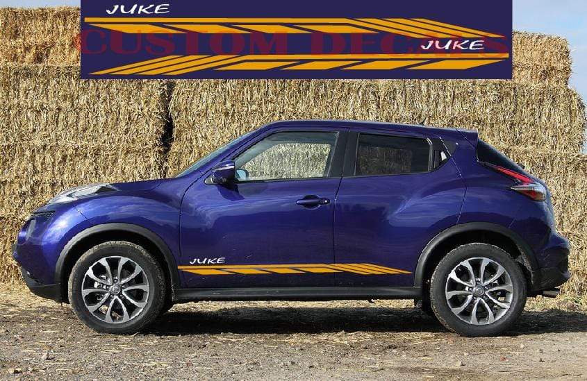 A Nissan Juke hatchback parked in front of a bale of hay with a vinyl decal for the vehicle brand displayed on the hay.
